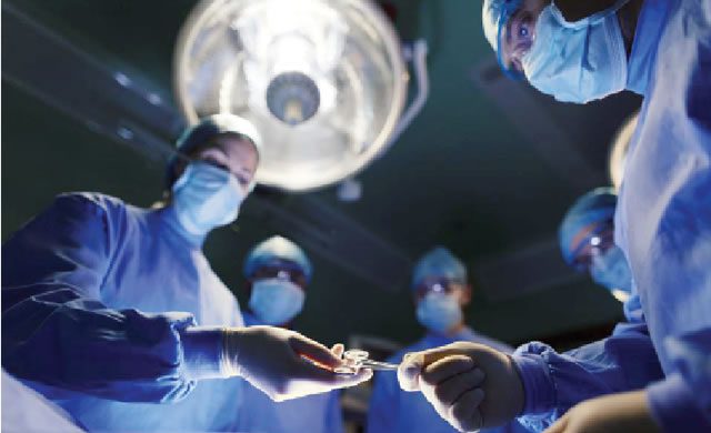 , 202102Surgeons conducting a surgical operation