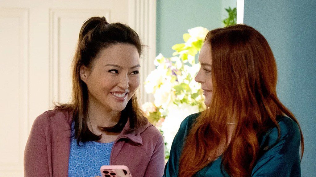 From left to right: Elizabeth Tan and Lindsay Lohan in "Irish Wish" (Netflix)